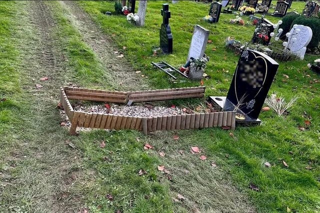 <p>A grave damaged by track marks </p>